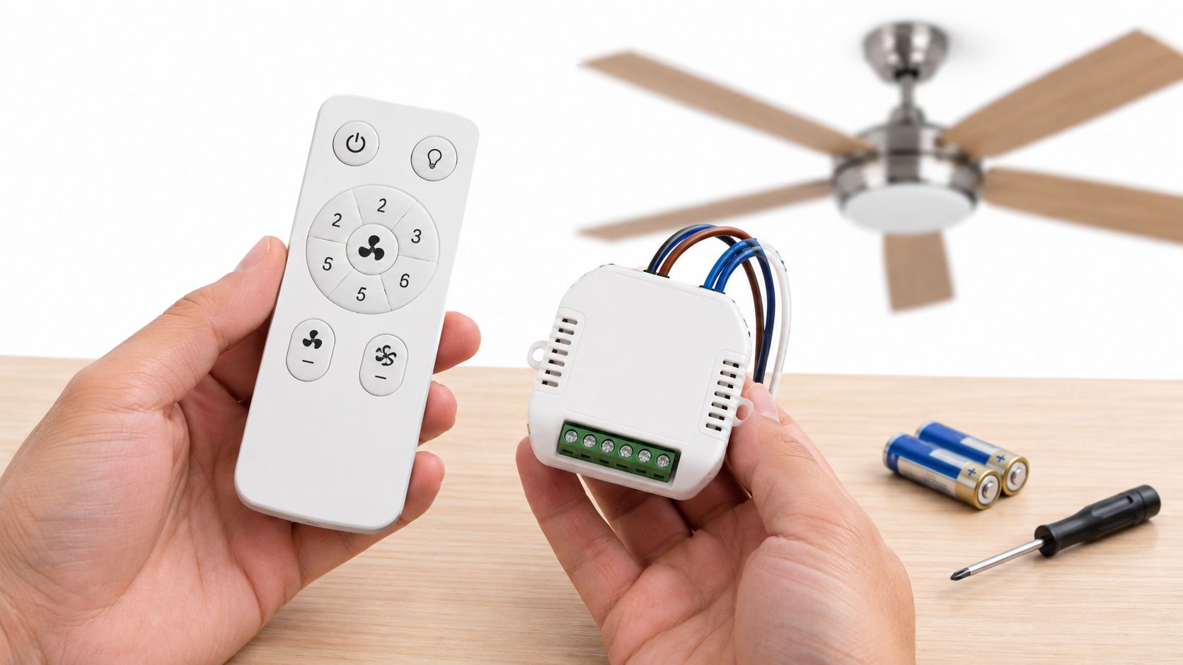 A person holding a remote control and receiver unit for a ceiling fan repair project.